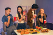 © NINENII - drinks and conversation, social gathering and get together. Young people, group and happiness at fast food pizzeria, celebration at home.