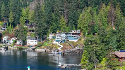 Wall Mural - an aerial drone shot of luxury homes with their own private dock in Indian River Drive, North Vancouver.