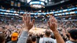 © Ilja - Excited Fans Raise Their Hands in Anticipation During an Intense Basketball Game at the Arena