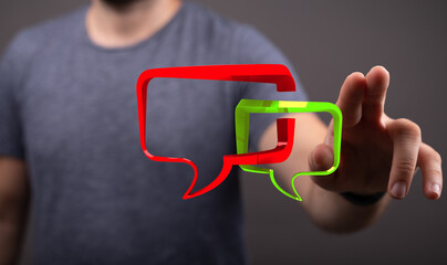Man reaching for 3D speech bubbles, illustrating digital communication, connection and modern technology, promoting conversation and feedback.