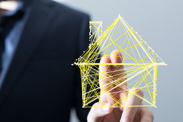 Wall Mural - Abstract network house touched by a hand. Concept of real estate, technology, connection, and innovation. Represents digital homes and smart liv