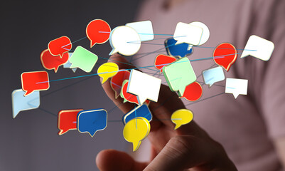 Wall Mural - A hand reaching toward multiple colorful 3D speech bubbles, networked together by lines. Representing communication and connection in digital sp