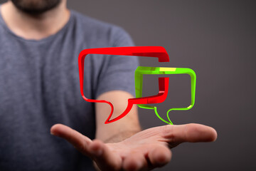 Wall Mural - Man hand shows digital communication with speech bubbles. Modern technology, connection, and interaction concept. Online communication on the in