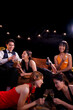 © maeching - Beautiful woman having fun with group of friends clinking champagne glasses during celebration party. Drink concept.