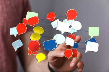 Wall Mural - Hand holding speech bubble network. Conceptual illustration of digital communication, social media connection and networking.