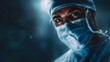 © Thares2020 - Close up portrait of a serious surgeon wearing a mask and glasses illuminated by dramatic lighting