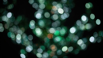 Festive bokeh lights creating an abstract Christmas tree pattern at night