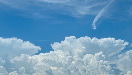 Wall Mural - Gorgeous fluffy clouds set against a vibrant azure backdrop