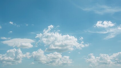 Wall Mural - White Puffy Clouds Against a Clear Blue Sky