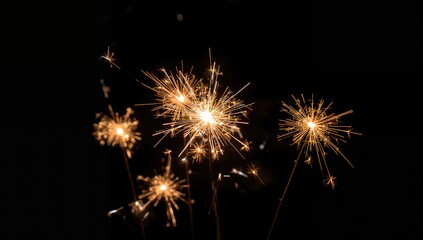 Wall Mural - Close-up of multiple vibrant firework sparklers against a dark backdrop, ideal for festive celebrations