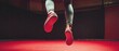 © acilll - Person jumping athletic shoes red surface dynamic action fitness sports exercise