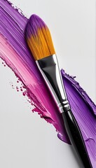 Wall Mural - a makeup brush rests upon vibrant streaks of purple and pink lipstick against a clean white background.