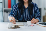 Financial Planning Focus: A focused individual meticulously organizes and strategizes finances at a well-organized workspace. A pen in hand she guides her vision of financial success.