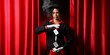 © Pixel-Shot - Female African-American magician showing trick with cards on stage