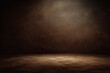 © fakii - A textured, dimly lit studio space with a gradient of browns. Light illuminates center