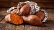 © Honey - Warm, delicious baked sweet potatoes wrapped in foil, a wholesome, comforting meal perfect for autumn or winter.