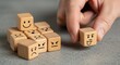 © Makbul - Wooden cubes with different emotions representing mood and social intelligence concept
