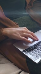 Wall Mural - Animation of light and shapes over hands of caucasian woman using laptop