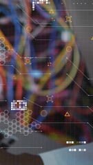 Wall Mural - Animation of data processing over african american male engineer using laptop at server room