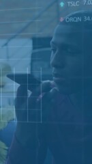 Wall Mural - Animation of financial data processing over african american businessman using smartphone
