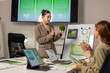© Wasana - Businesswoman presenting esg concept with moss ball in meeting