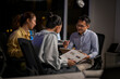 © Wasana - Business colleagues collaborating late night during meeting