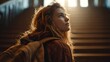 © horizon - Thoughtful and evocative photograph from behind a female student with a backpack, looking up a wide staircase that ascends into a bright light.