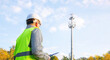 © A Stock Studio - Male engineer inspector maintains a telecommunications tower. Inspecting 4G and 5G network equipment. Maintenance of cellular communication poles.