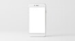 © Linda - A white smartphone stands centered on a white background screen blank
