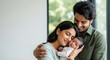 © PRASANNAPIX - Happy Indian Parents Embrace Their Newborn Baby with Love