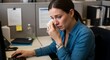© Rakib - Woman crying at her office desk while working on her computer