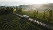 © Molang Visual - A white truck is traveling on a road through lush green fields under a sunny sky.