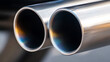 © photo for everything - Chrome exhaust pipes, sleek and powerful, catch the light with vibrant reflections, hinting at performance and style. Curves and shadows add depth to the image.