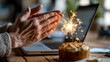 © ABF_MATEO - A festive virtual celebration with a cake and a sparkler, shared with colleagues and friends from the comfort of the home office space.