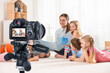 © New Africa - Protecting children's right to privacy in digital environment. Taking video or photo of little kids and nursery teacher in kindergarten