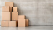 © siraphol - Stack of cardboard boxes in storage room creates minimalist and organized atmosphere