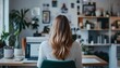 © Studicon - Woman working from home at a desk with plants and laptop