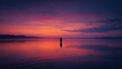 © Imron - a tranquil scene at sunset by the water. a solitary figure is captured in mid stride along the calm shoreline, with their reflection mirrored on the surface of the water