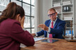 © crizzystudio - Lawyer discussing legal problems with distressed client