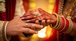 © Passionwith - Close-up of Indian Wedding Hands with Henna and Gold Rings