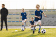 © matimix - Kids Sprint Soccer Drill with Coach – Youth Football Speed and Ball Control Training Session
