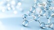© lililia - A collection of blue carbon molecules is elegantly arranged against a soft white backdrop, highlighting their intricate connections