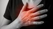 © D-point - Woman touching her chest with an hand, feeling pain or discomfort. Medical concept of heart attack, heartburn, or anxiety issues for healthcare.