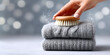 © magpie - Hand brushing wool sweater, performing gentle textile care for knitwear.