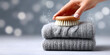 © magpie - Hand brushing wool sweater, performing gentle textile care for knitwear.