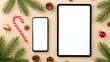 © Atallal Annas - Festive holiday flat lay with blank screen tablet and smartphone.