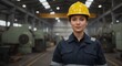 © Tanyastock - Female factory worker in safety uniform and hard hat