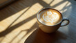 © Your Hand Please - Hyperrealistic image of latte art under direct morning light, highlighting intricate foam patterns, warm sunlight, cozy coffee ambiance, and the inviting beauty of a fresh morning beverage.