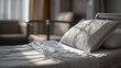 © Parol - A close up of a hospital bed with a white pillow and blanket in a brightly lit room setting view