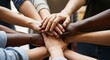© nupa - Diverse Group of People Stacking Hands Together in Unity and Teamwork.
